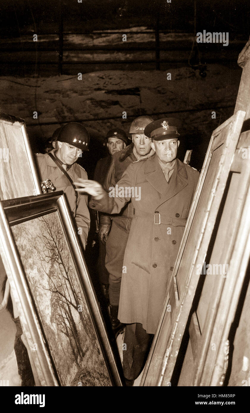 General Dwight D. Eisenhower, Supreme Allied Commander, accompanied by Gen. Omar N. Bradley, and Lt. Gen. George S. Patton, Jr., inspects art treasures stolen by Germans and hildden in salt mine in Germany.  April 12, 1945.  Lt. Moore.  (Army) NARA FILE #:  111-SC-204516 WAR & CONFLICT BOOK #:  1099 Stock Photo
