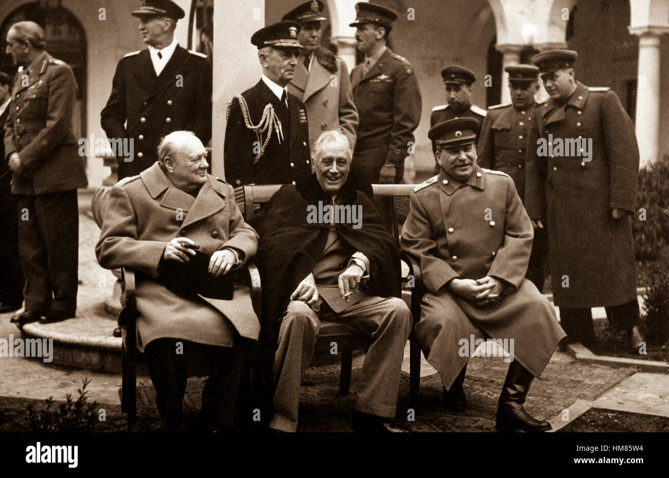 Conference of the Big Three at Yalta makes final plans for the defeat of Germany.  Here the 'Big Three' sit on the patio together, Prime Minister Winston S. Churchill, President Franklin D. Roosevelt, and Premier Josef Stalin.  February 1945. (Army) Exact Date Shot Unknown NARA FILE #:  111-SC-260486 WAR & CONFLICT BOOK #:  750 Stock Photo