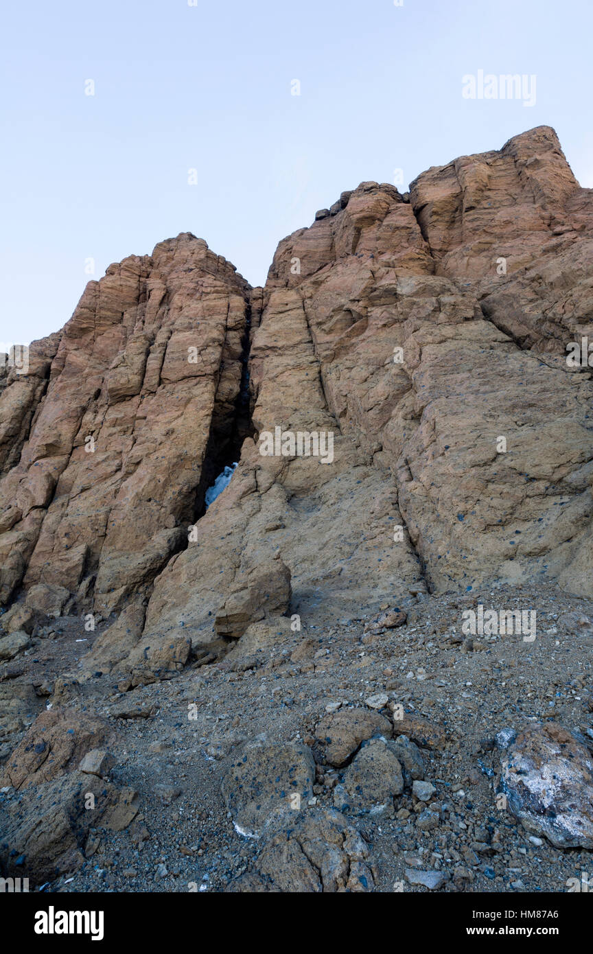 The barren rock wall of a mountain crag in Antarctica. Stock Photo