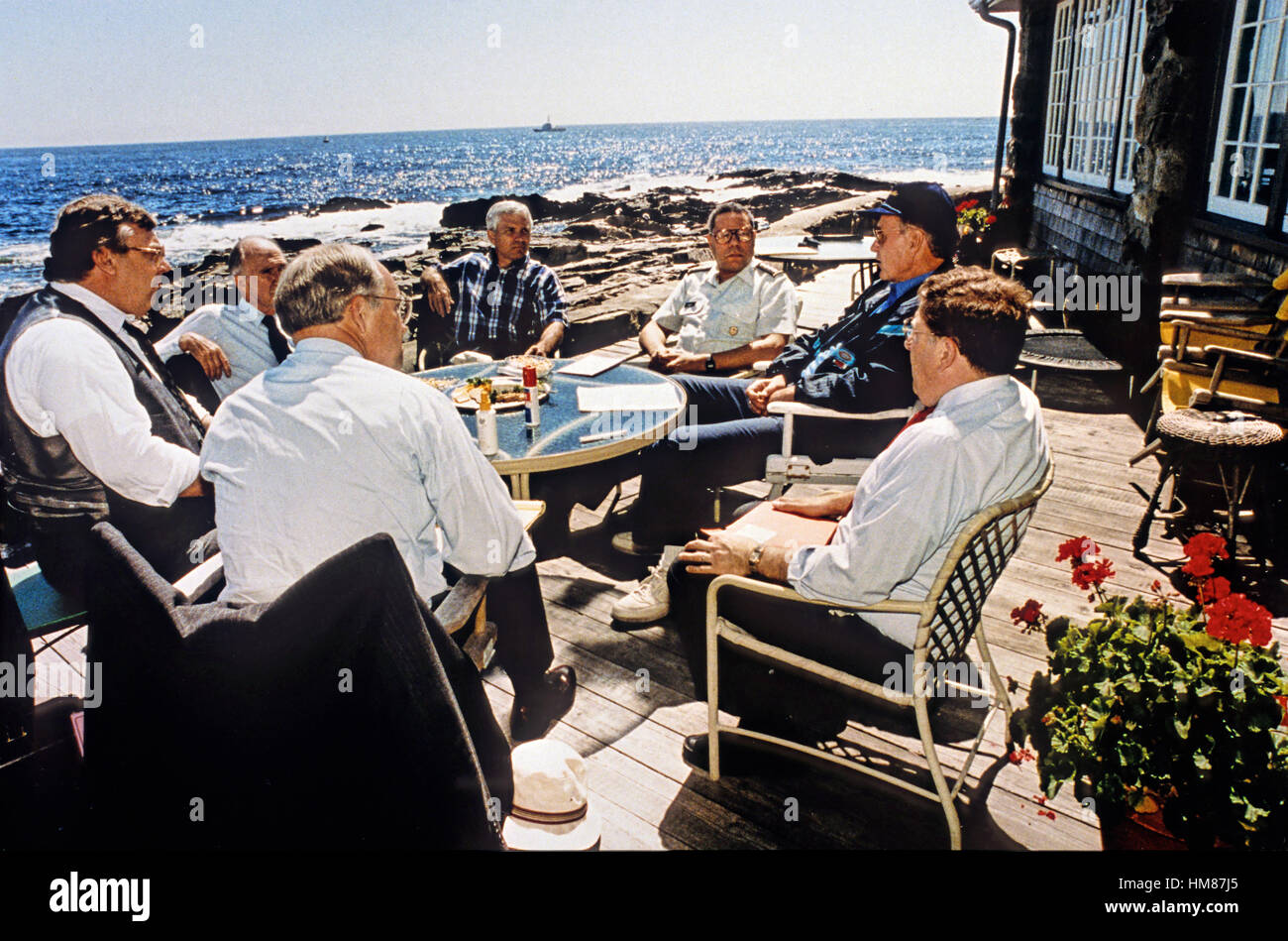 United States President George H.W. Bush meets with senior national security advisors on sending U.S. Troops to Saudi Arabia at his home at Walkers Point in Kennebunkport, Maine August 22, 1990. Mandatory Stock Photo