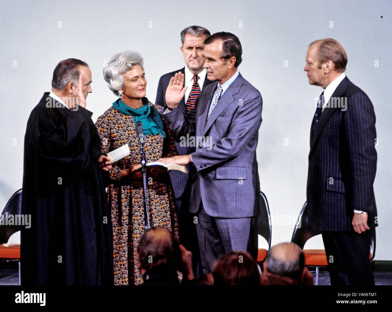 George H.W. Bush is sworn in as new director of the Central Intelligence Agency by United States Supreme Court Associate Justice Potter Stewart as Mrs Barbara Bush and U.S. President Gerald R. Ford look on at CIA headquarters in Langley, Virginia on Janua Stock Photo
