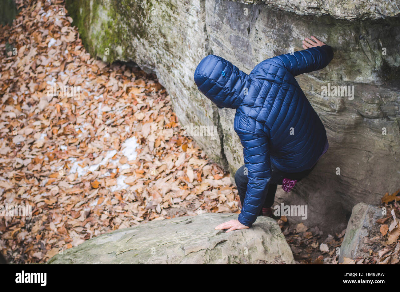 Man in Jacket and Hood Climbing Down Rocky Hiking Path Stock Photo Alamy