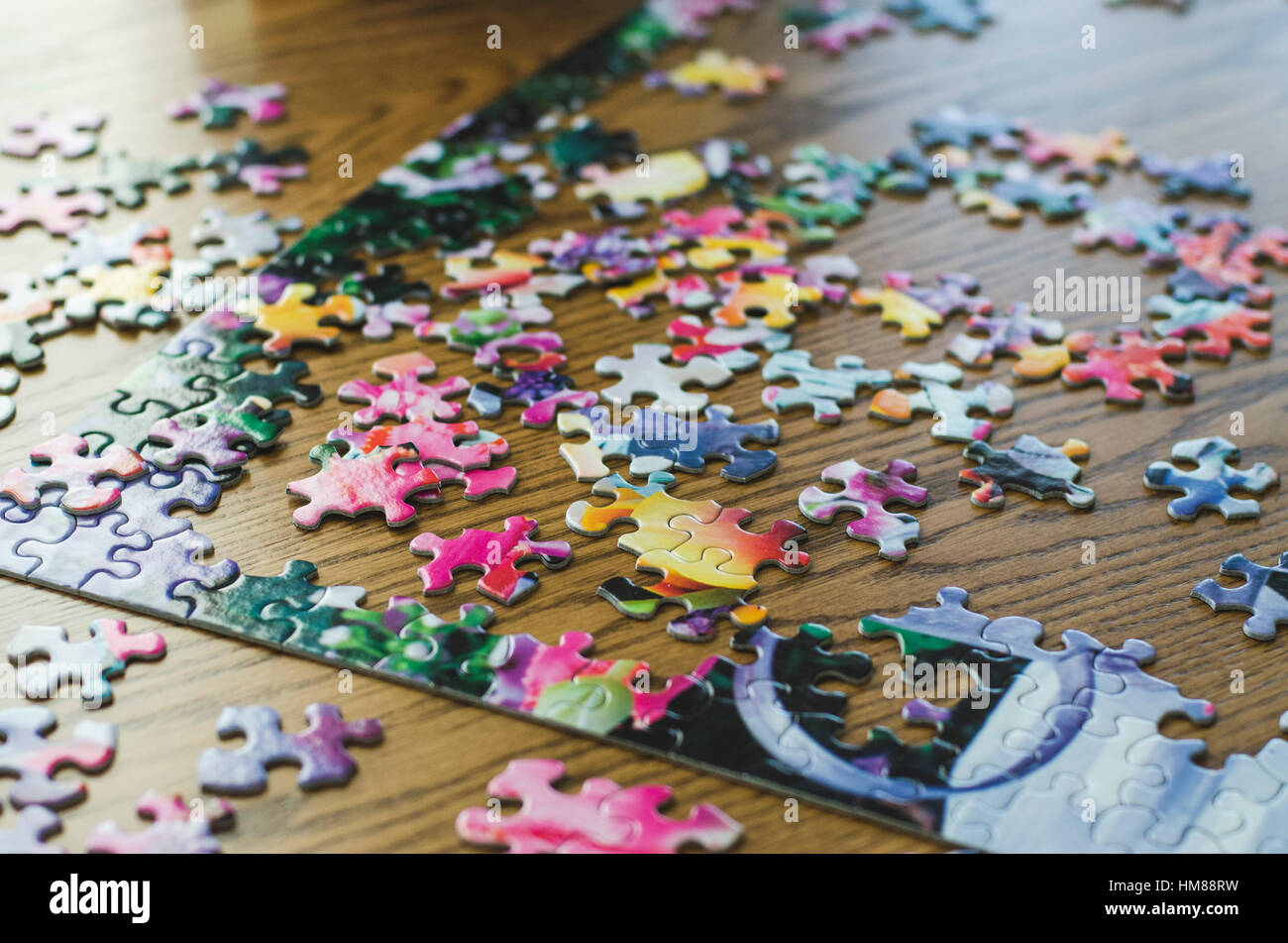 Jigsaw Puzzle and Pieces in Progress Stock Photo