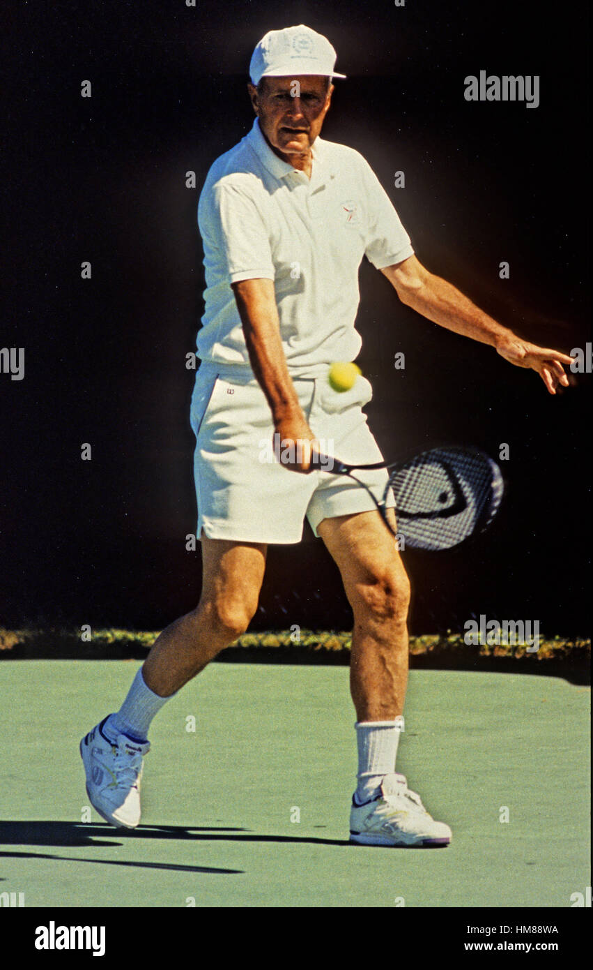 United States President George H.W. Bush plays a game of tennis at his summer vacation home in Kennebunkport, Maine on August 8, 1991..Mandatory Stock Photo