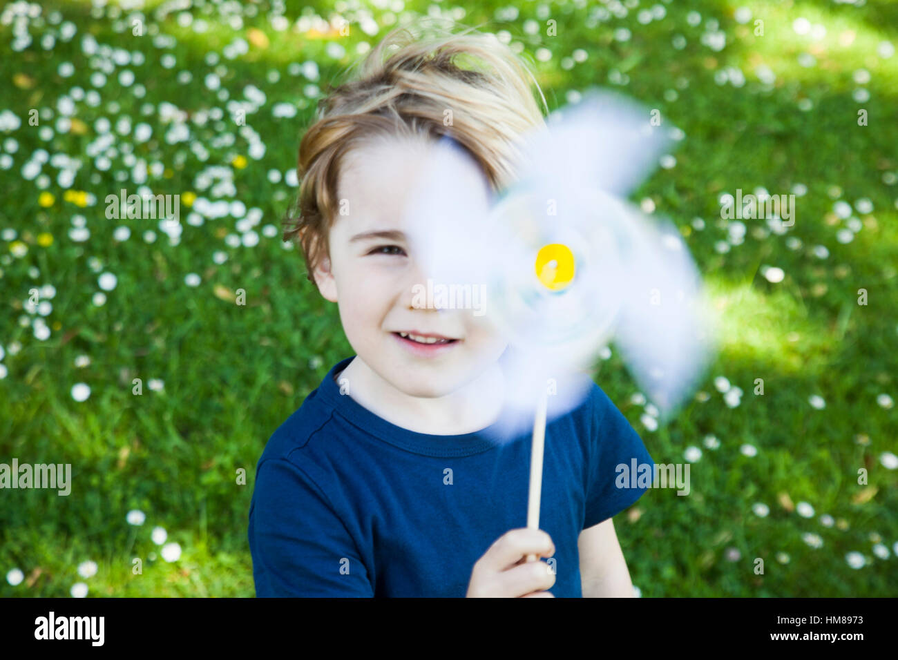Young Boy with Pinwheel Toy Stock Photo