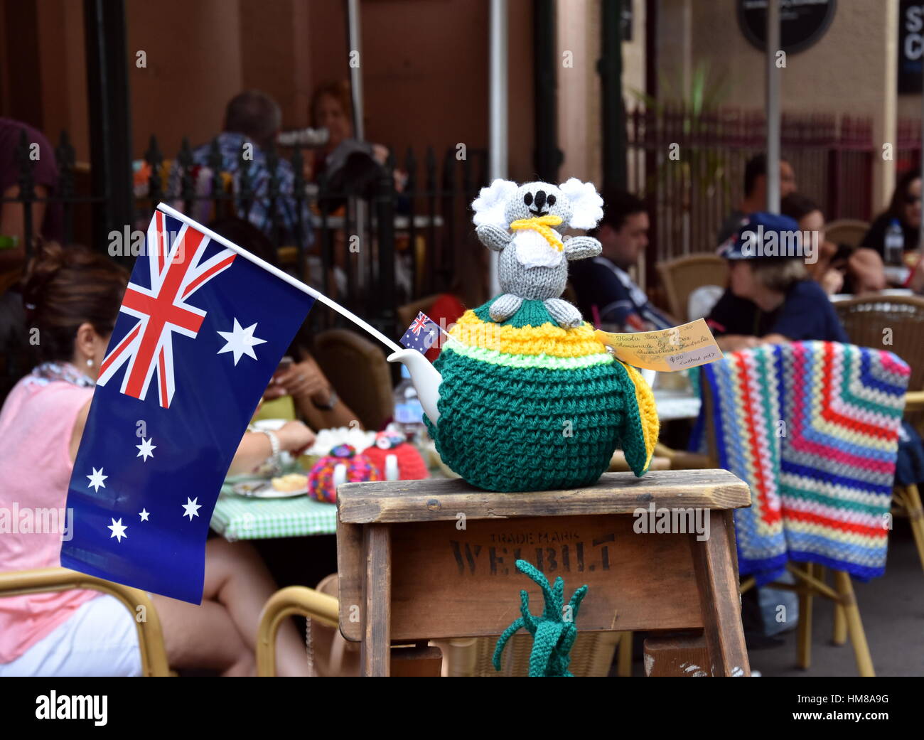 Sydney, Australia - January 26, 2017. Knitten Koala sitting on a yellow and green knitten teapot cosy which was inspired by Australia day. Australia f Stock Photo