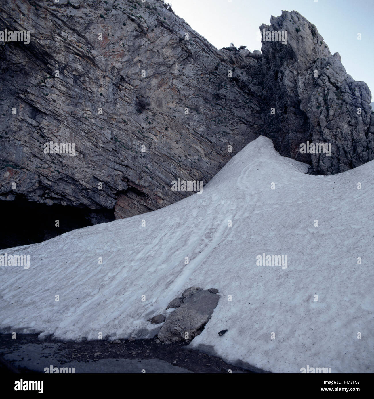 Snow at the mouth of Ideon Cave or Ideon Andron, according to myth the birthplace of Zeus, slopes of Mount Psiloritis or Mount Stock Photo
