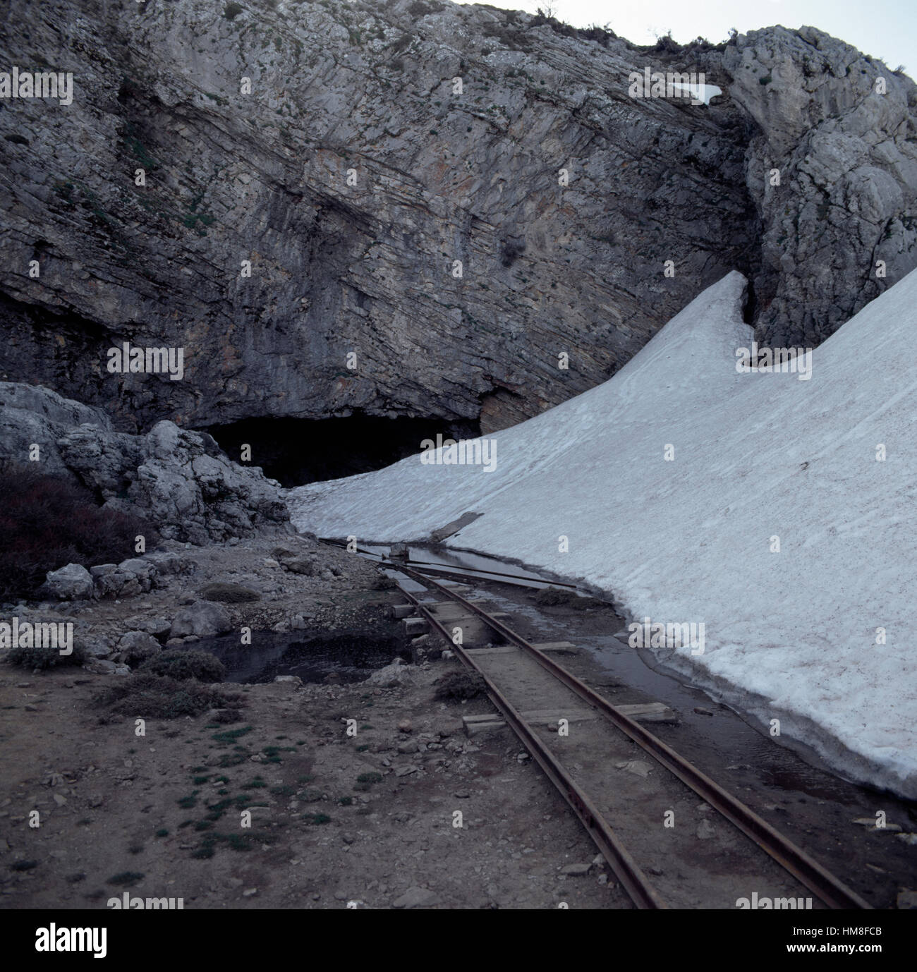 Snow at the mouth of Ideon Cave or Ideon Andron, according to myth the birthplace of Zeus, slopes of Mount Psiloritis or Mount Stock Photo
