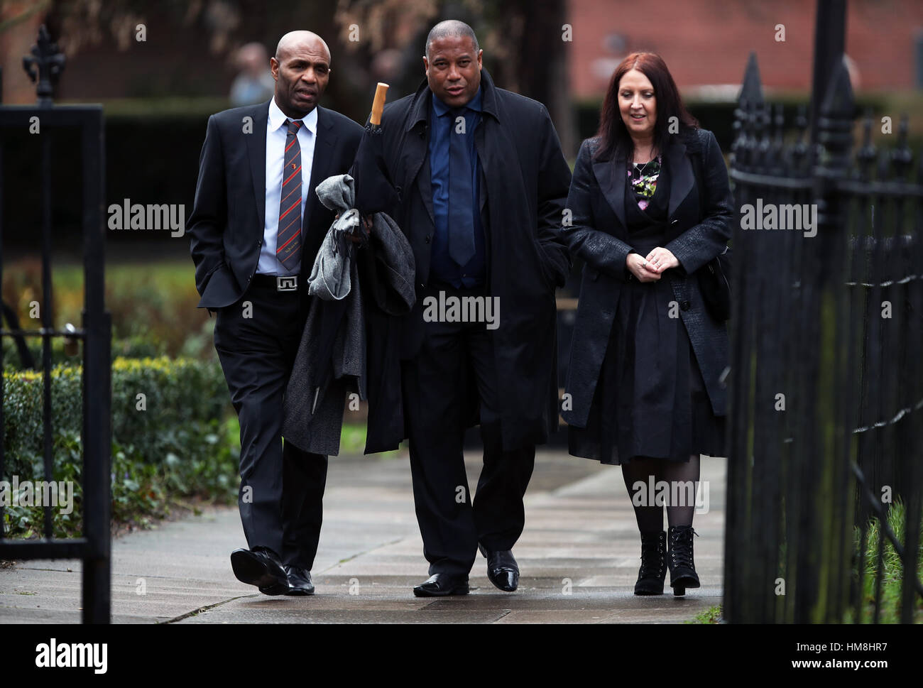 John Barnes (centre) and Luther Blissett (left) arrive for the funeral service for Graham Taylor held at St Mary's Church, Watford. Stock Photo