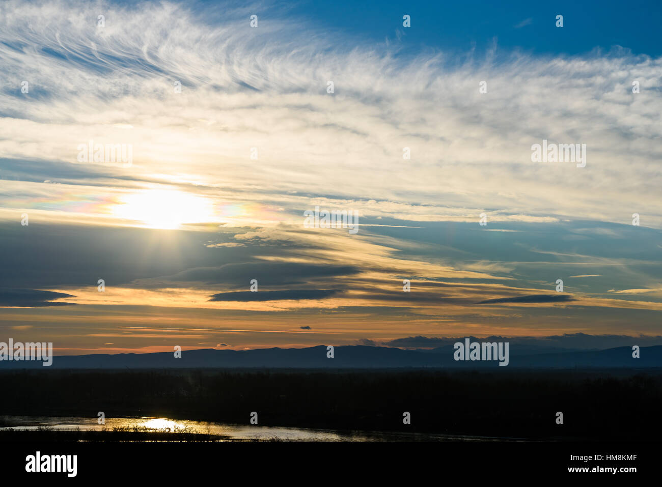 Beautiful Sunset Cloudy Sky Over Mountains Stock Photo - Alamy