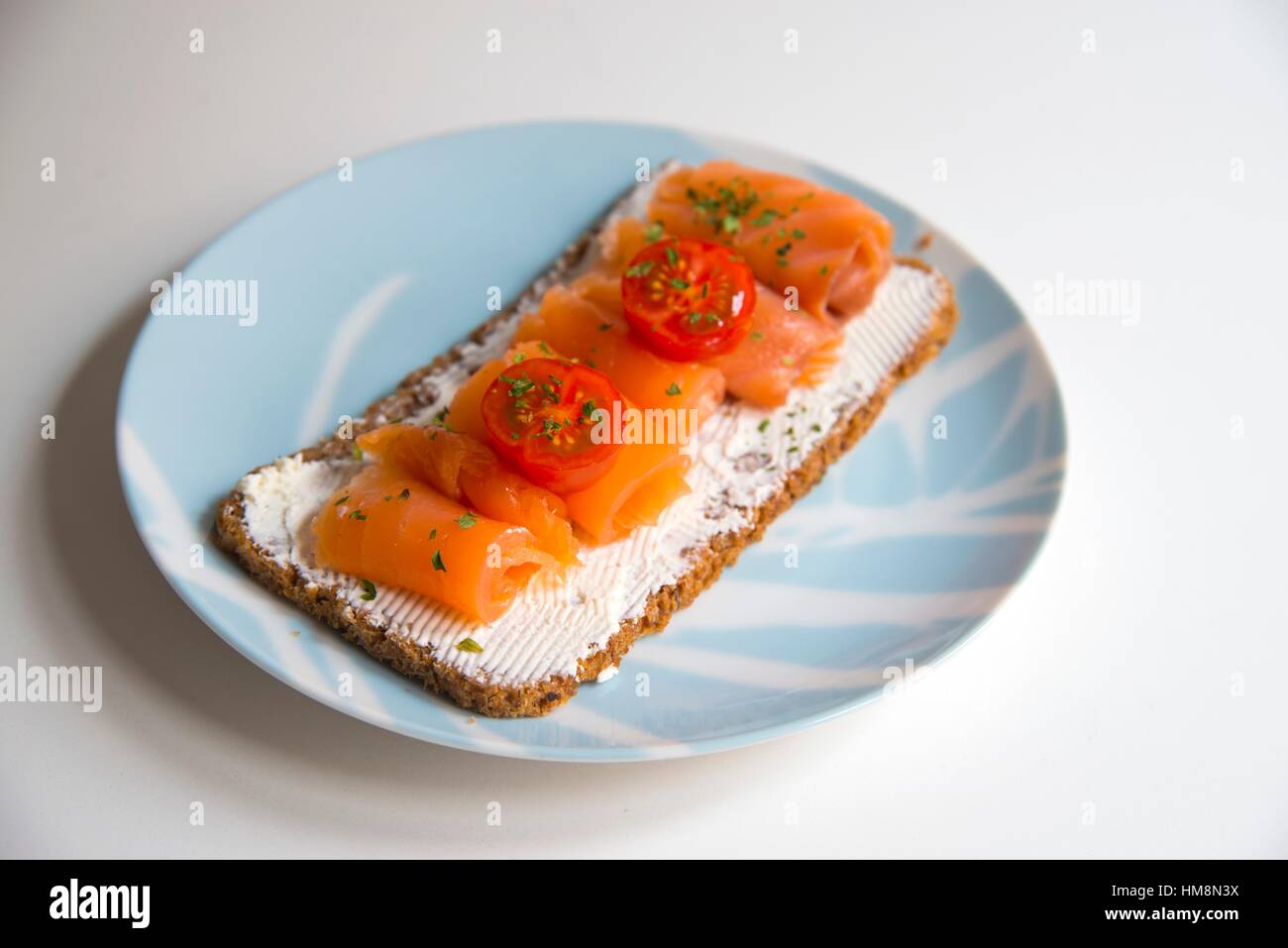 Smoked Salmon And Cottage Cheese Cream On Toast With Cherry