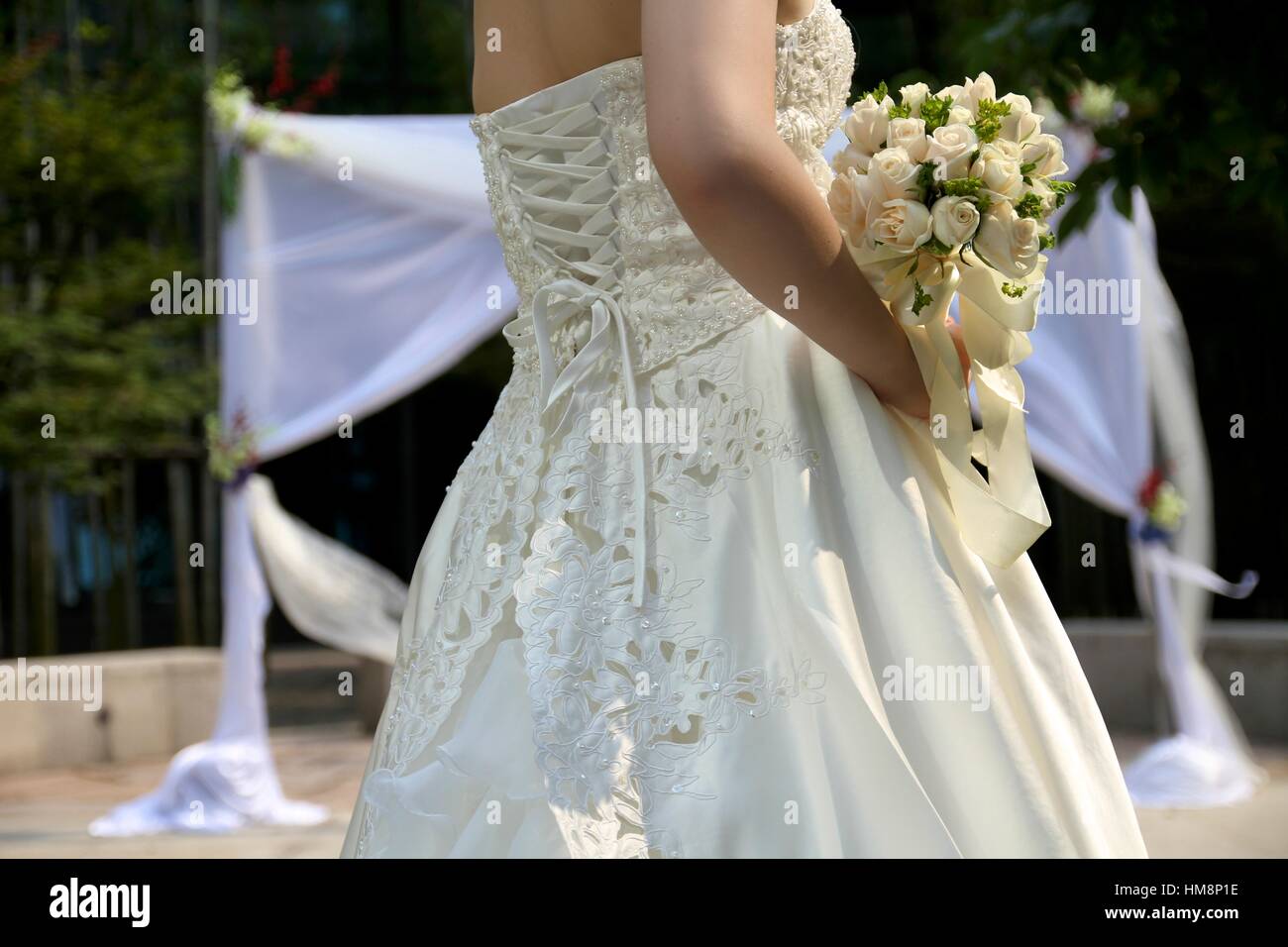 bride carrying a bouquet of flowers Stock Photo Alamy