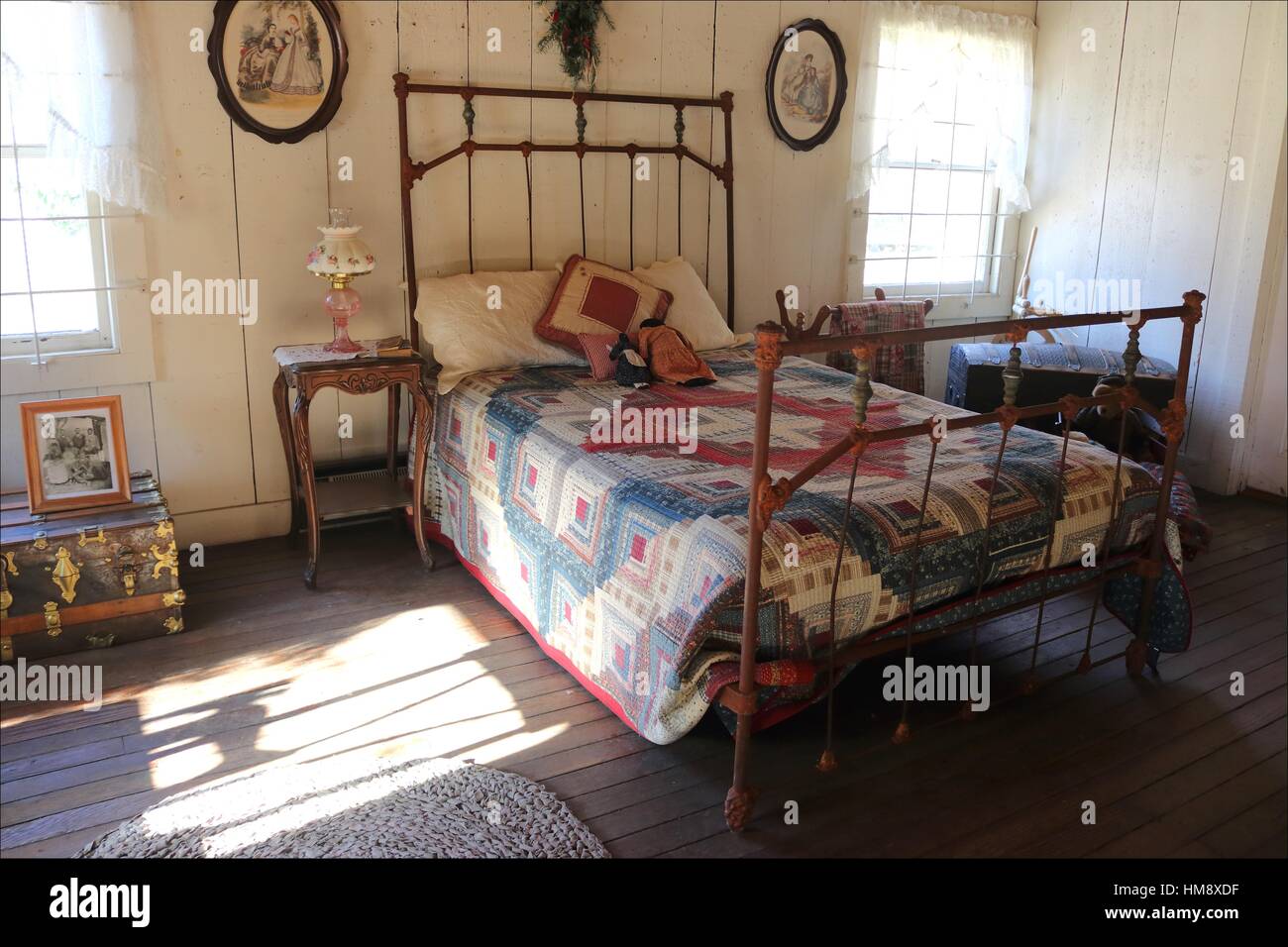 An Old Bed Dressed In A Handmade Quilt Are Found Inside An Old House Stock Photo Alamy