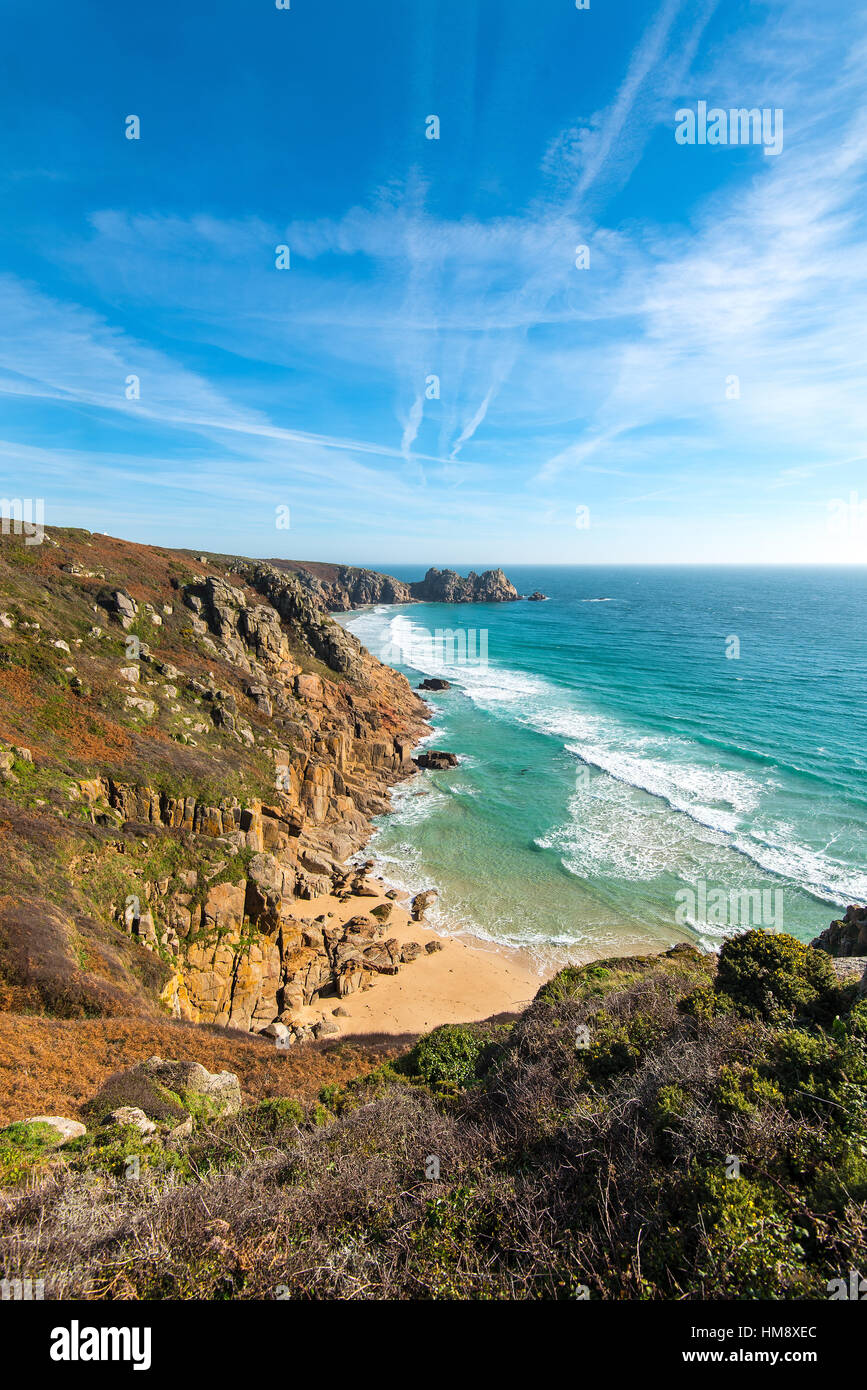 The tidal beach of Green Bay which is connected to Porthcurno and Pedn Vounder beaches at low tide. Stock Photo