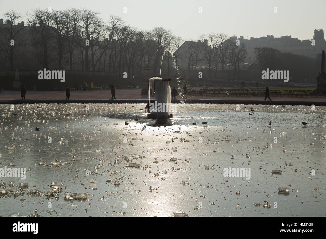 Luxembourg Gardens with frozen fountain in Montparnasse in the 14th arrondissement of Paris in winter Stock Photo
