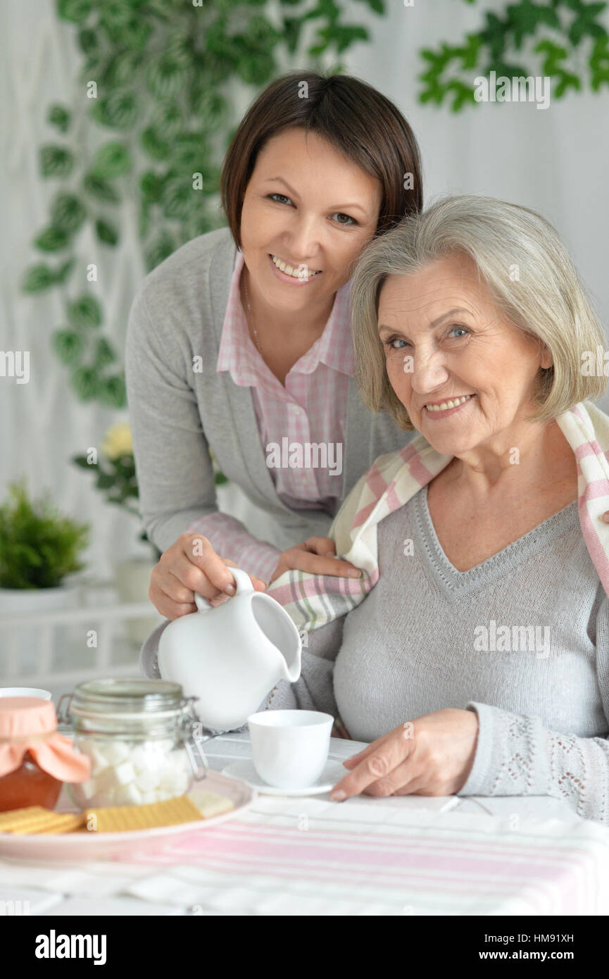 mother and daughter drinking tea Stock Photo - Alamy