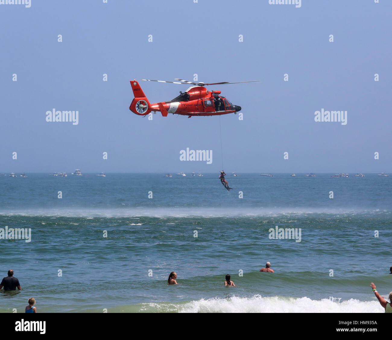 USCG Helicopter Rescue Demonstration lowering rescue swimmer Stock Photo