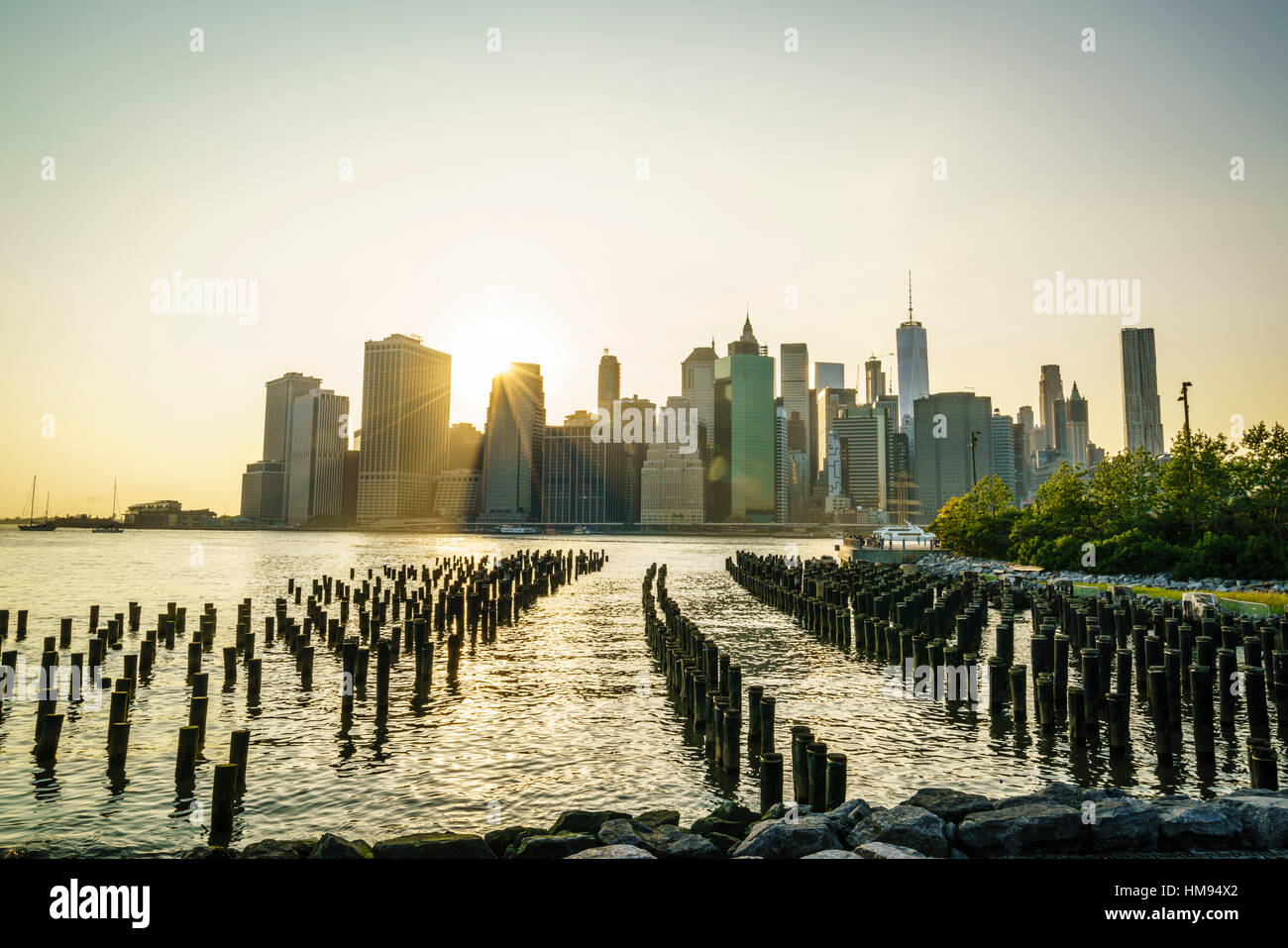 Lower Manhattan skyline across the East River at sunset, New York City ...