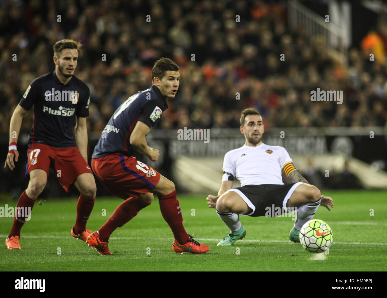 Soccer players Saul, Lucas Hernandez and Paco Alcacer during the Spanish La Liga soccer match between Valencia and Atletico de Madrid, at Mestalla stadium, in Valencia, Spain, Sunday, March 6, 2016. Stock Photo