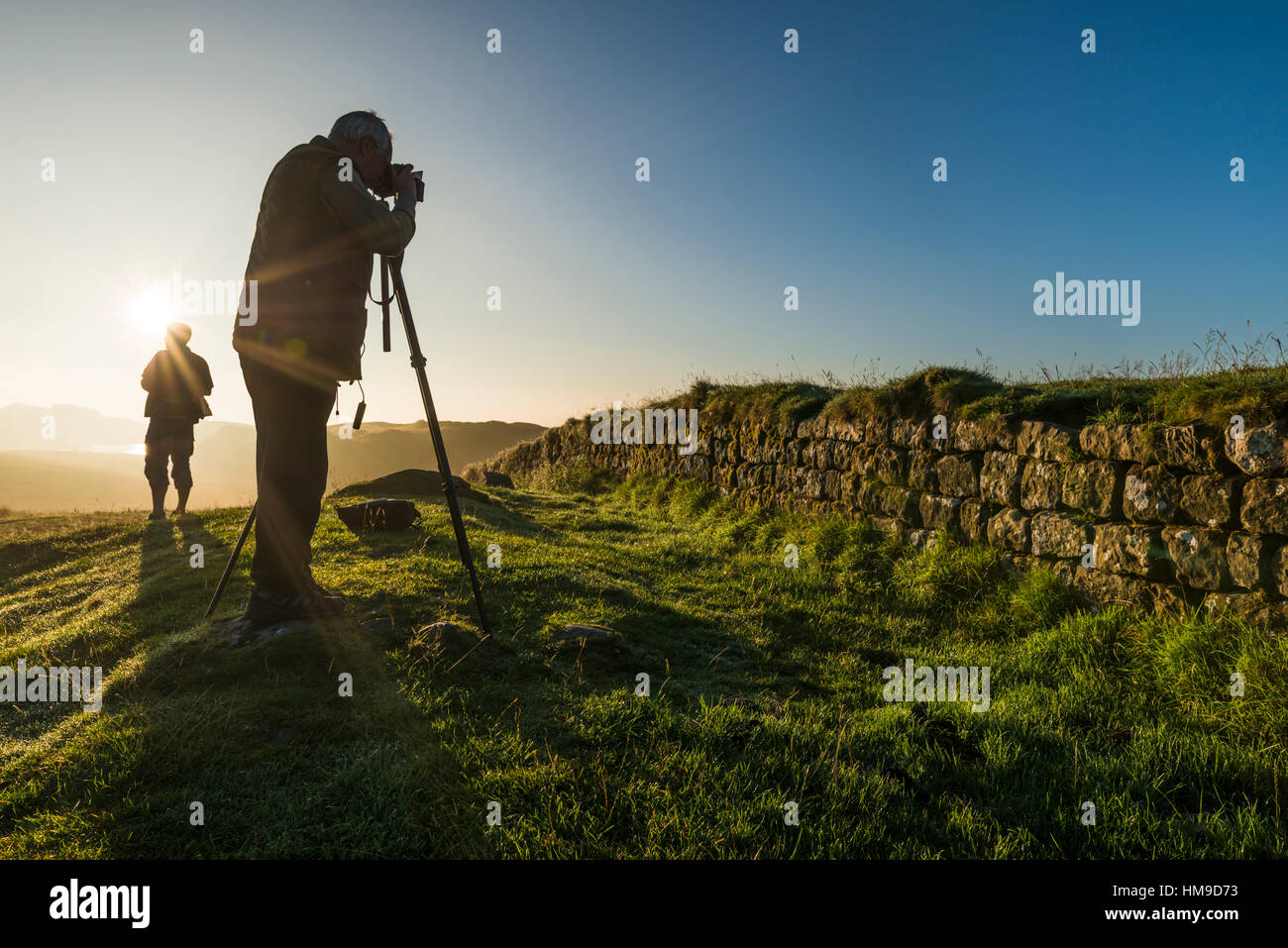 Photographers at Hadrian's Wall at Steel Rigg, Northumberland National Park, England Stock Photo