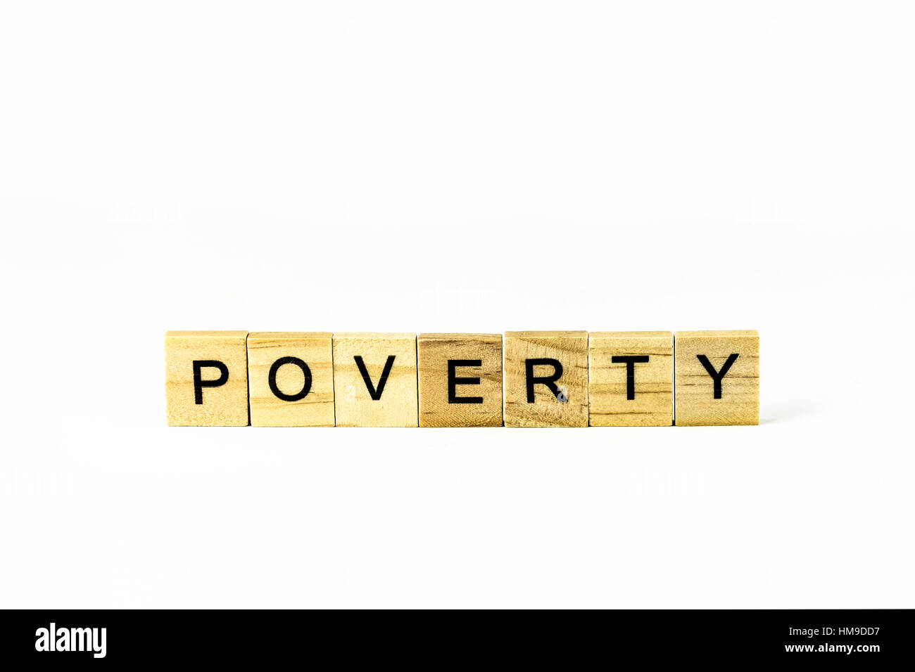 wooden blocks spelling concept word 'poverty' cutout. Stock Photo