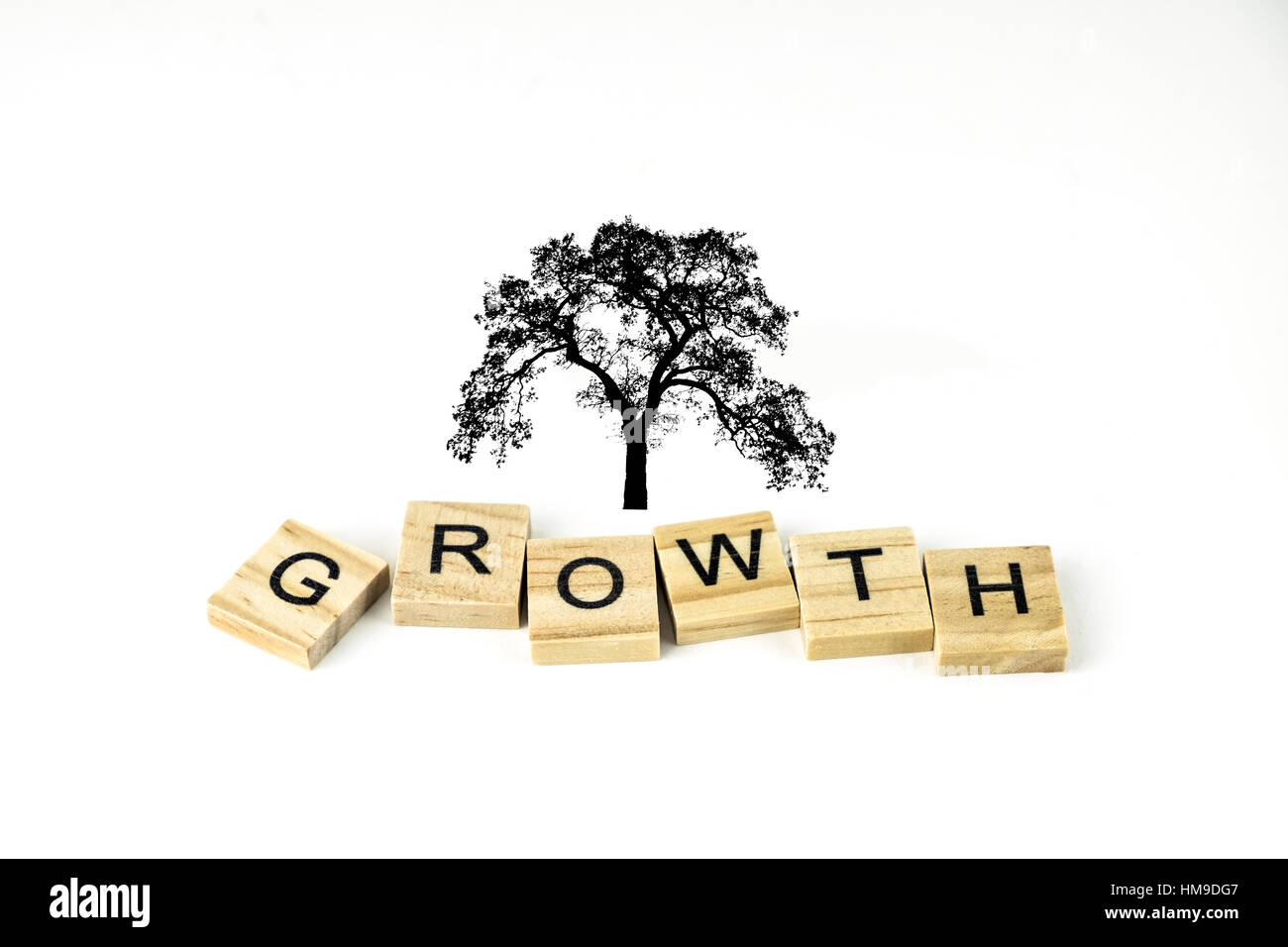 Blocks with the concept word Growth spelled out and a tree. Illustration. Stock Photo