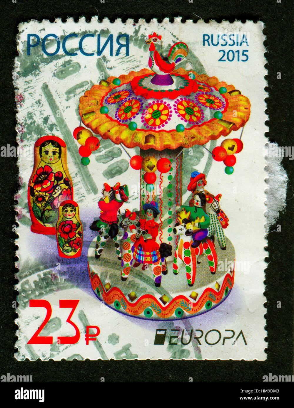 Stamp printed in Russia shows image of the matryoshka doll, also known as a Russian nesting doll, is a set of wooden dolls. Stock Photo