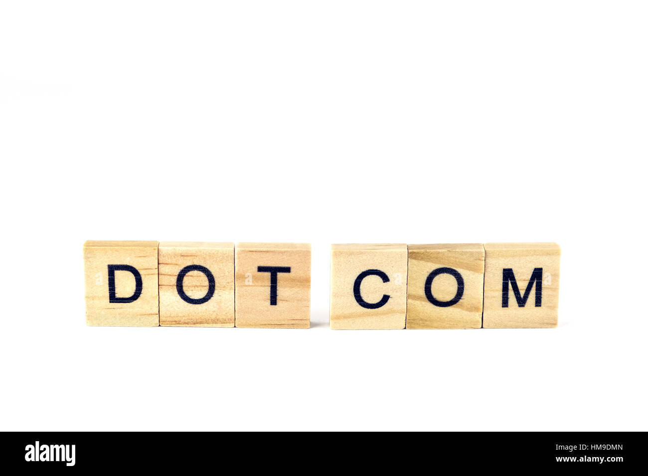 Wooden block letters spelling Dot Com on a white background. Concept, conceptual. Stock Photo