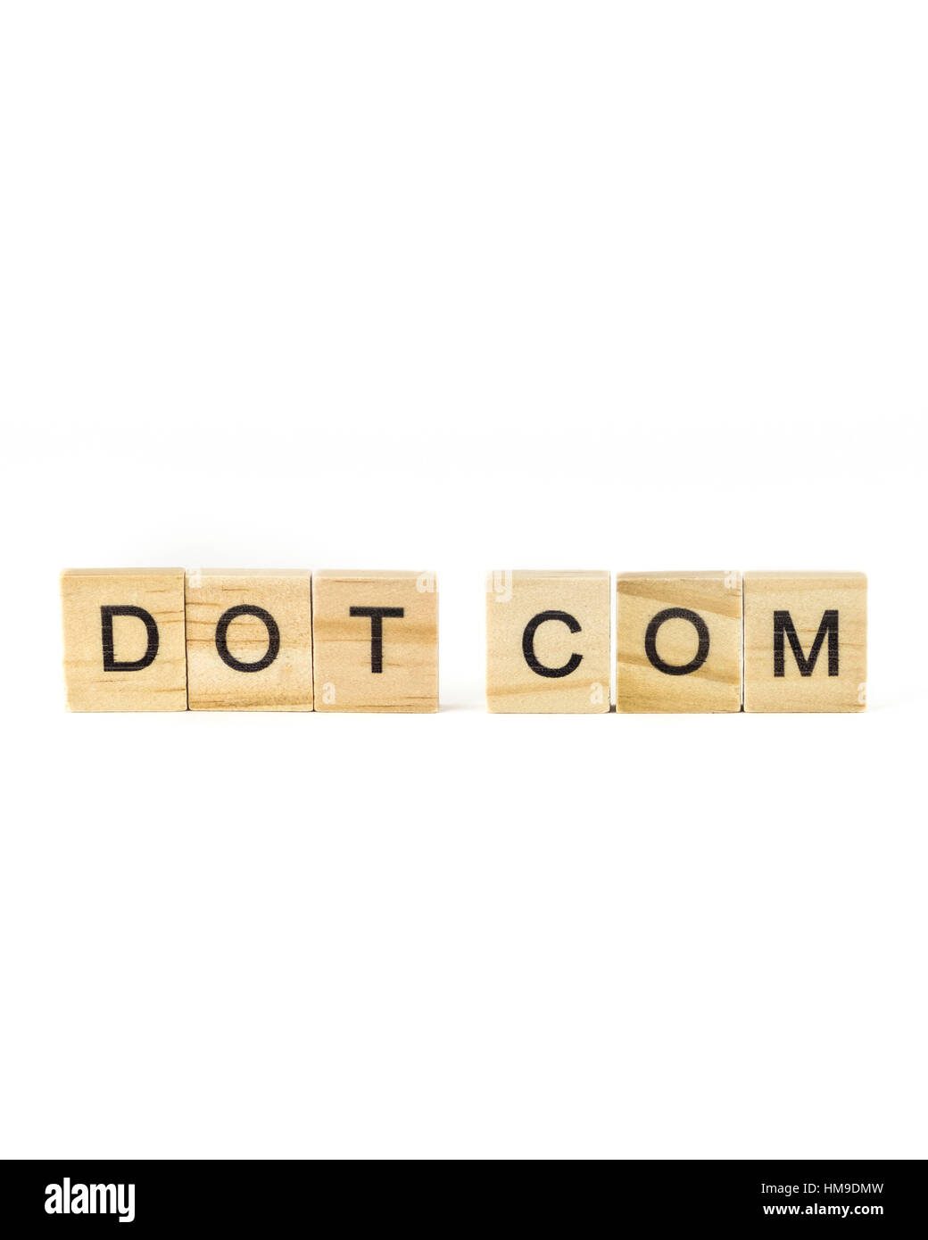 Wooden block letters spelling Dot Com on a white background. Concept, conceptual. Stock Photo