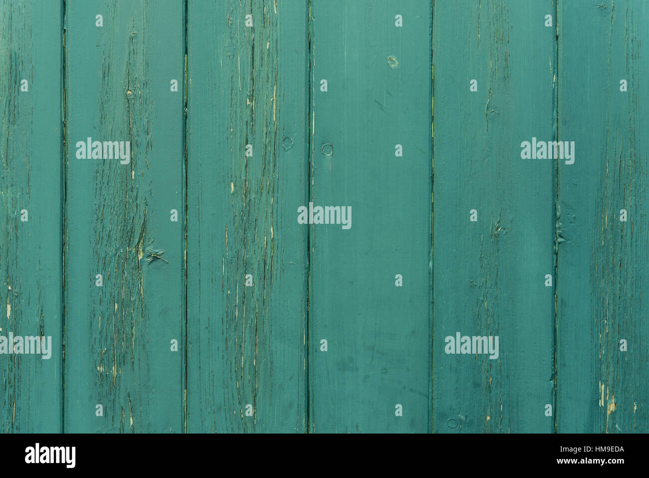 cracked green paint on wood timber planks texture background Stock Photo