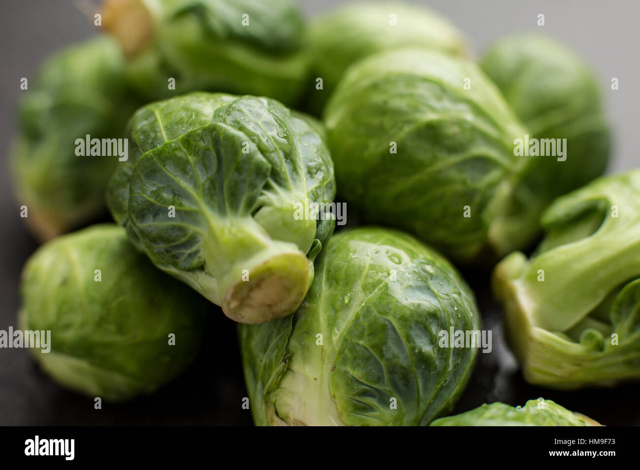 a close-up angle on a pile of organic brussels sprouts Stock Photo