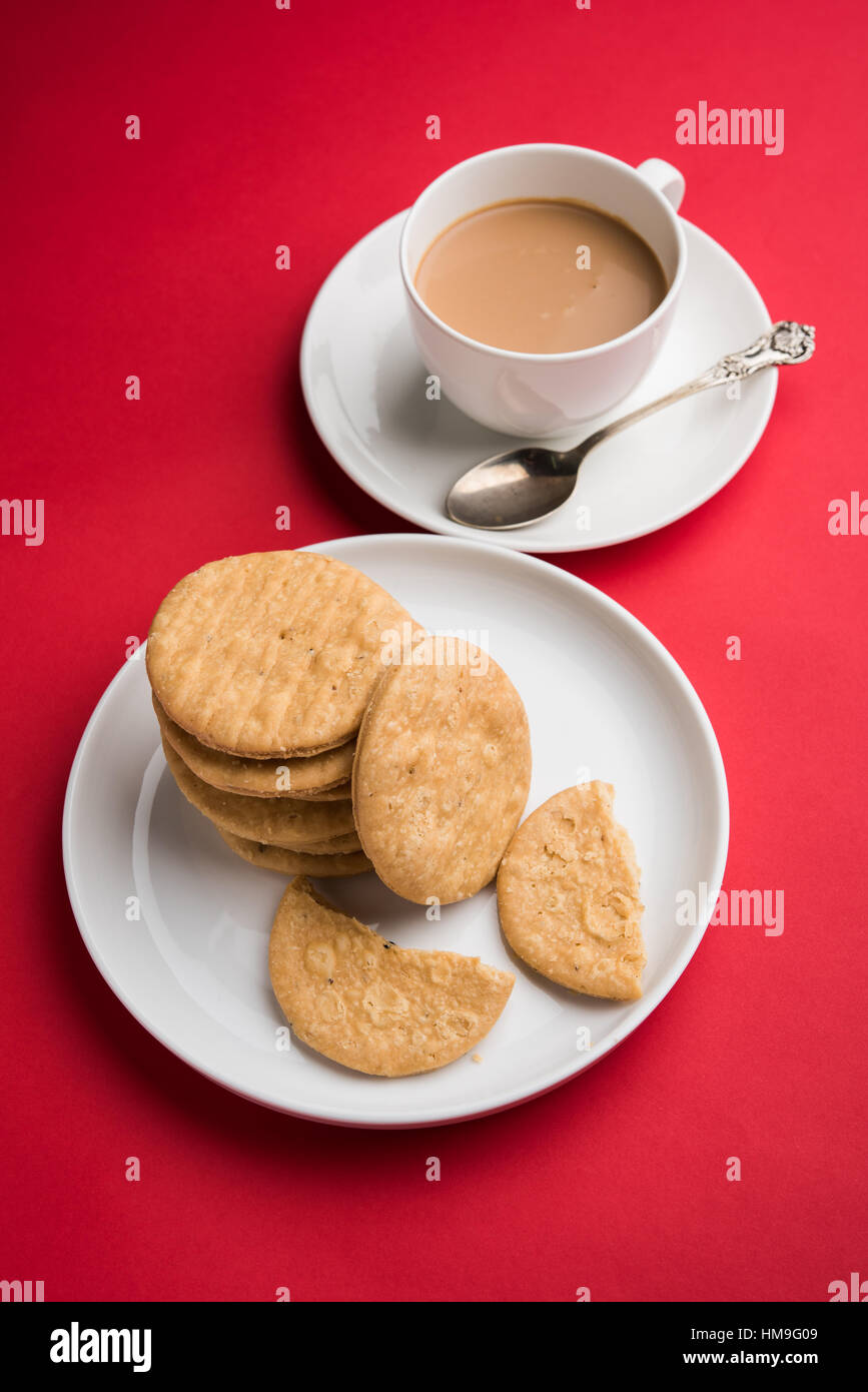 spicy fried mathri or mathari which is an indian snack served with a ...