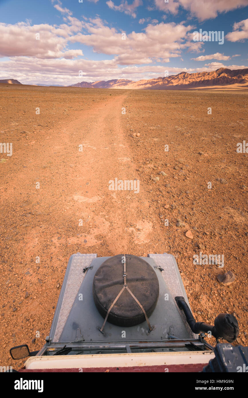 Offroad vehicle oldtimer driving off road in Morocco Stock Photo