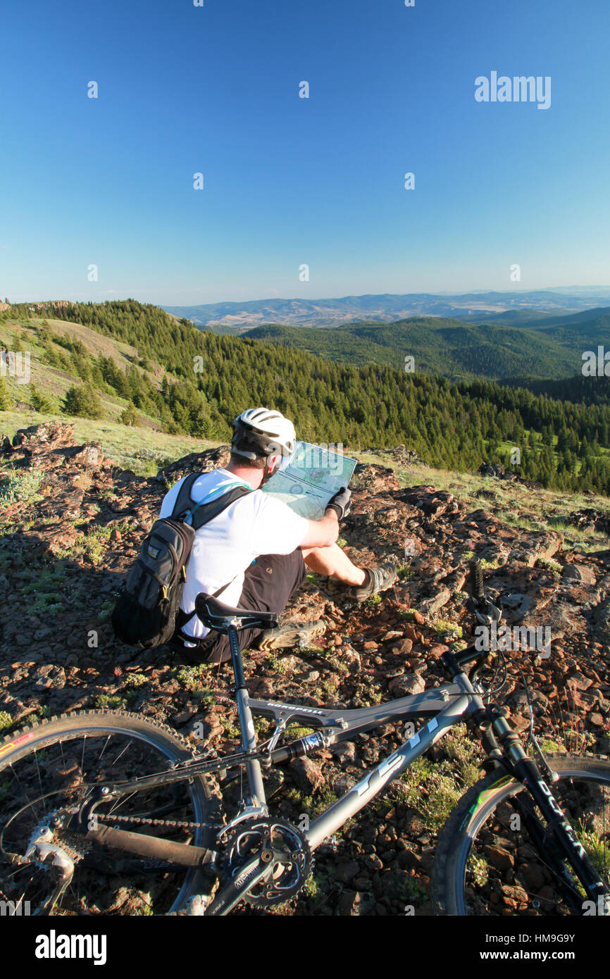 Mountain Biker Reviewing the Trail Map on Oregon's Lookout Mountain Trail Stock Photo