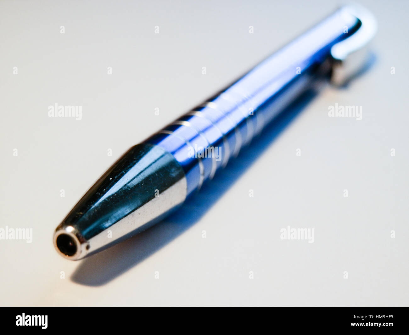 Sharp blue steel pen macro on white backround. 3 Stock Photo - Alamy