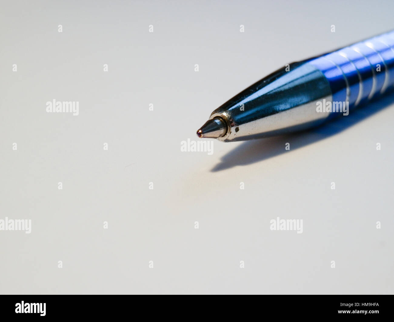Sharp blue pen macro on white backround. 1 Stock Photo - Alamy