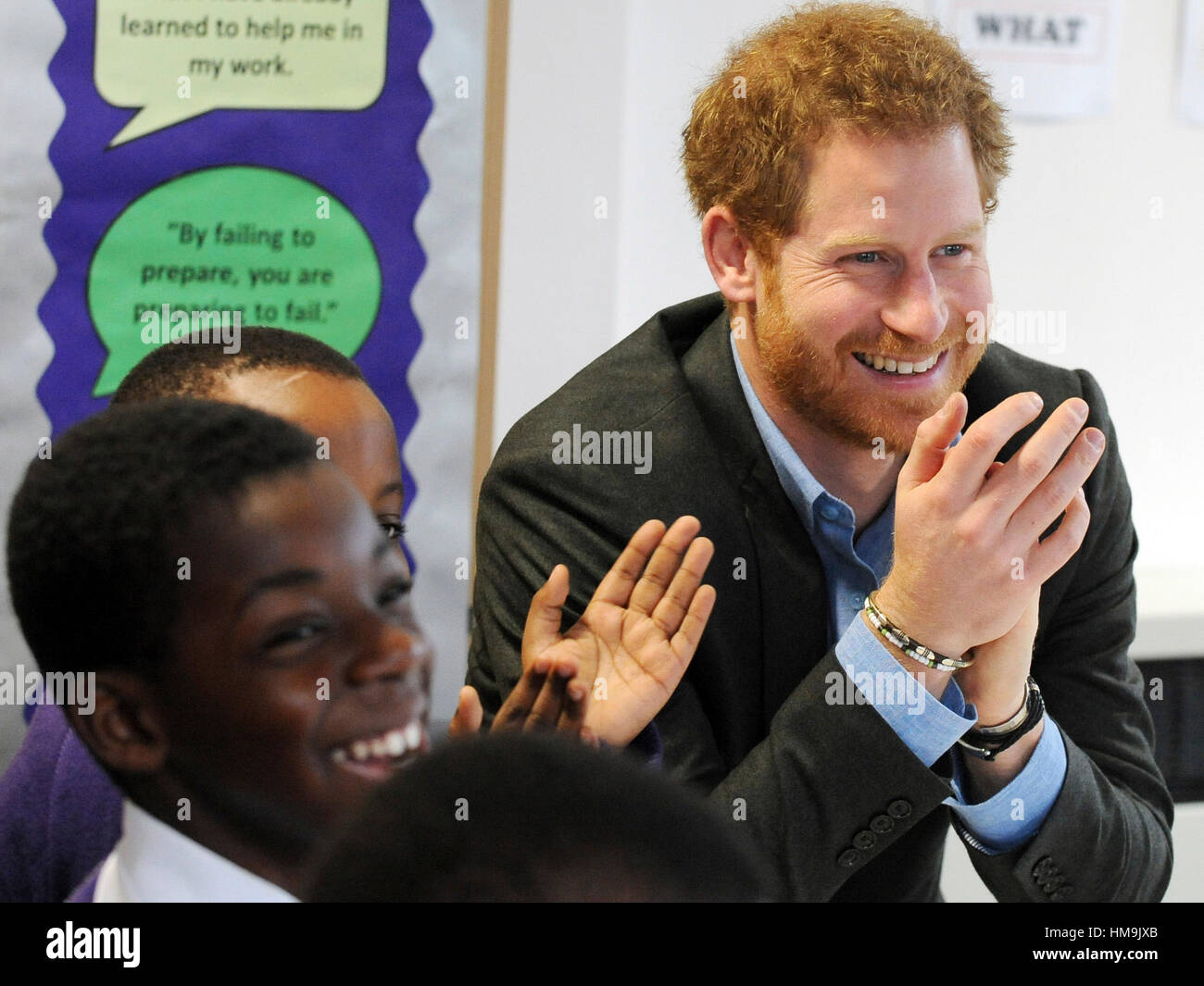 Prince Harry attends a lyrical writing class during a visit to the Full Effect and Coach Core programmes, two projects supported by The Royal Foundation that work to improve opportunities for young people, at Nottingham Academy. Stock Photo