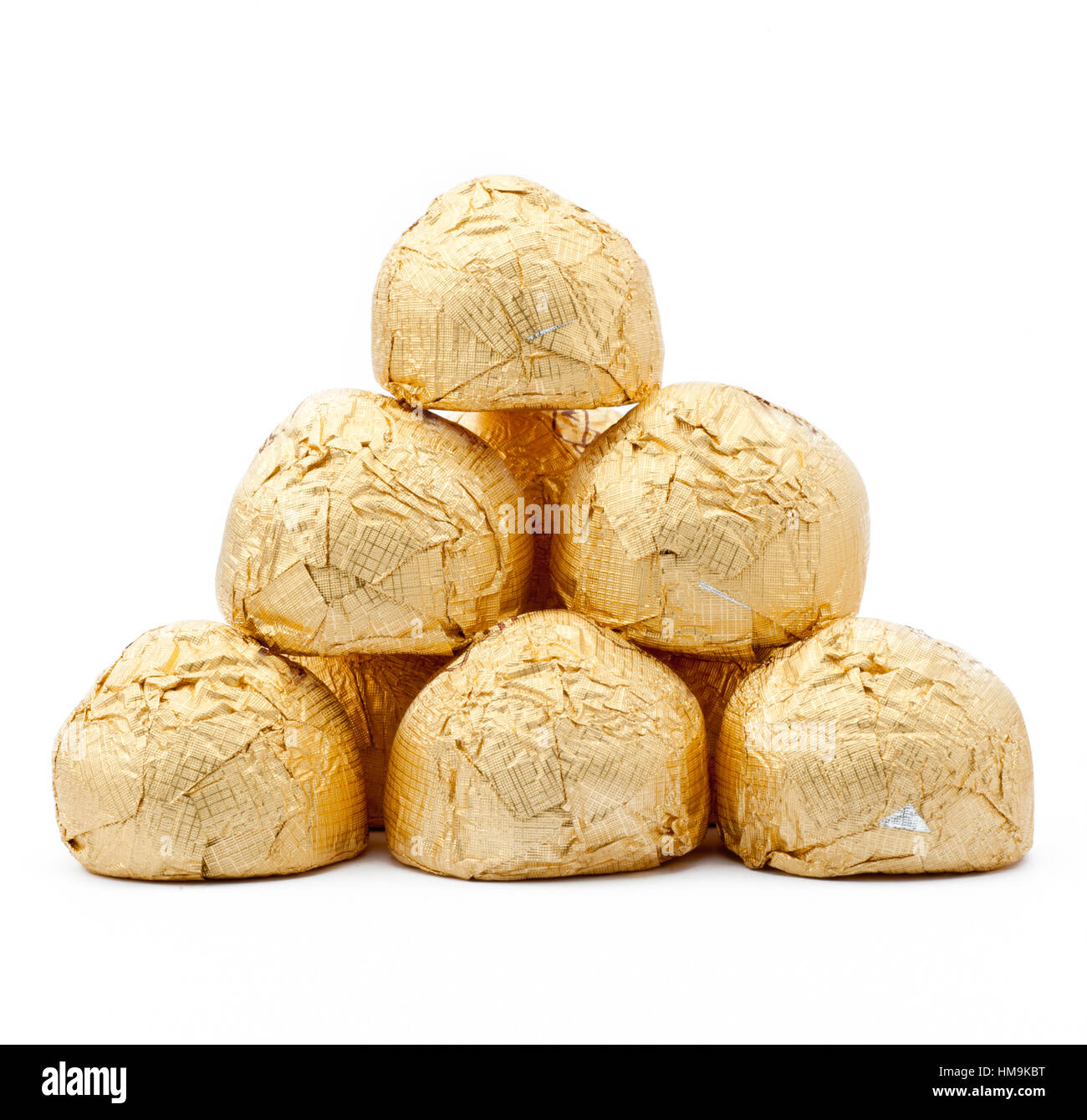 chocolates in a gold foil papper Stock Photo Alamy