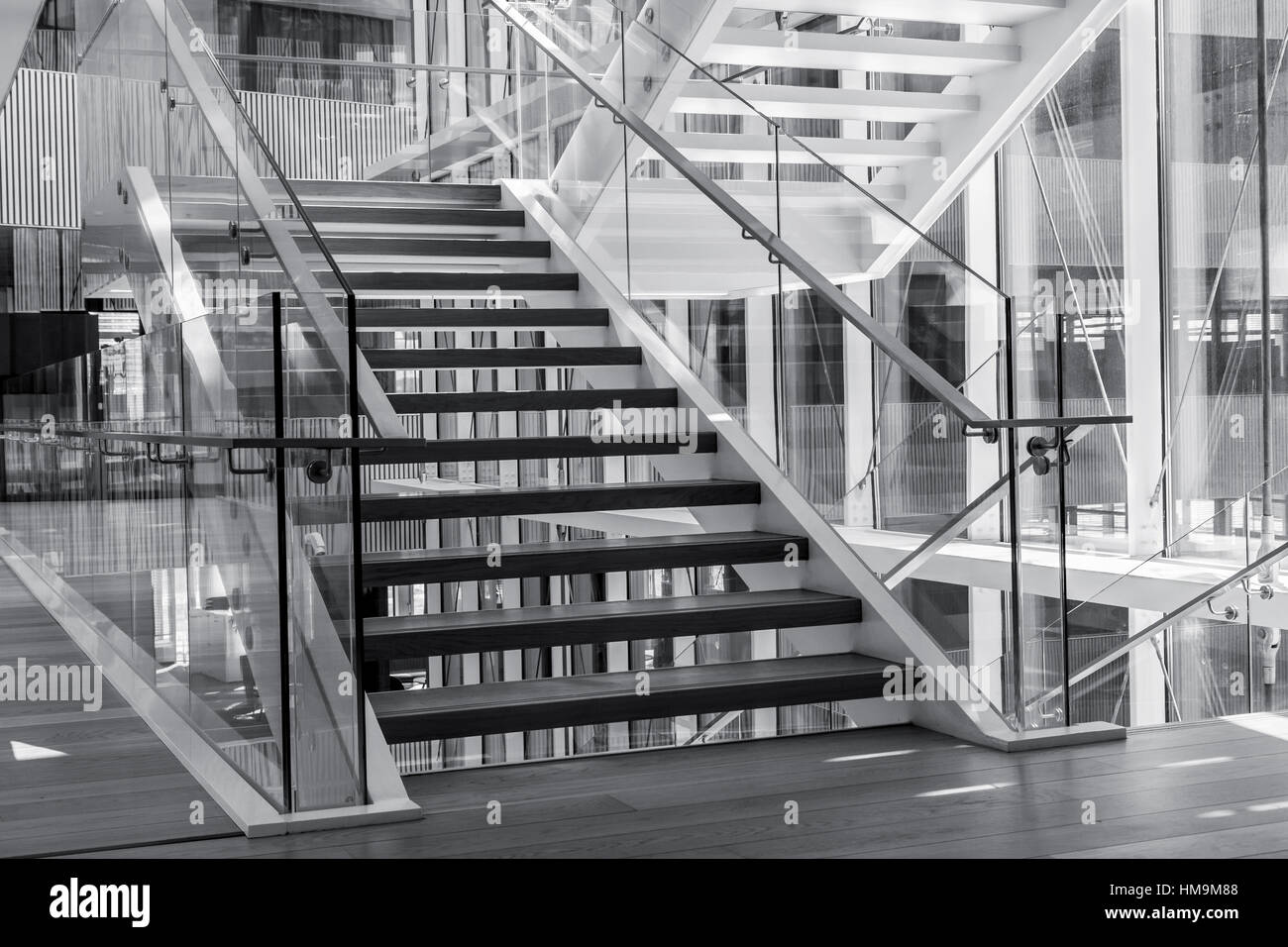 Indoors stairs in a modern architecture building. Black and white high contrast picture Stock Photo