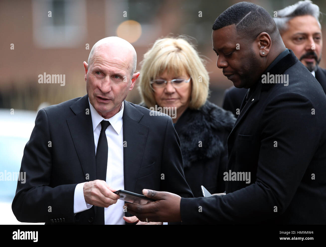 Gordon Cowans (left) arrives for the funeral service for Graham Taylor