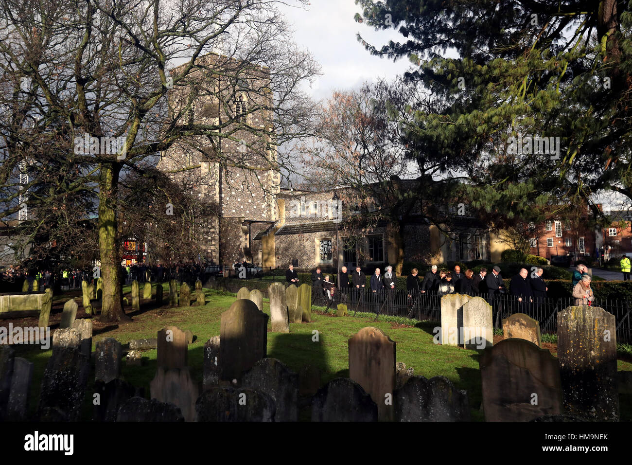 Guests leave the church after the funeral service for Graham Taylor