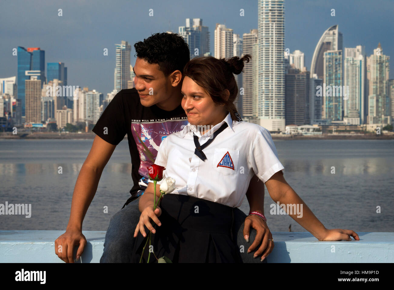 Two students lovers at Cinta Costera in Panama City. Skyline, Panama City, Panama, Central America. Cinta Costera Pacific Ocean Coastal Beltway Bahia  Stock Photo