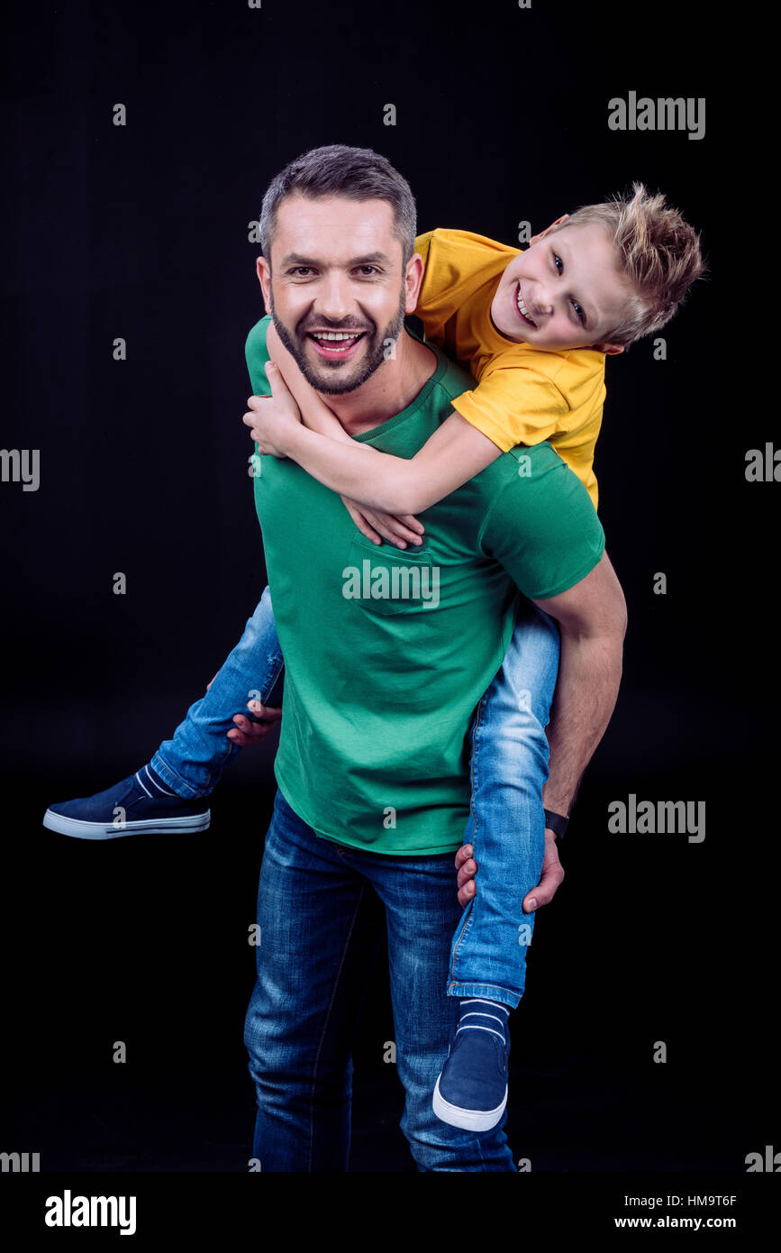 Father piggybacking happy child Stock Photo