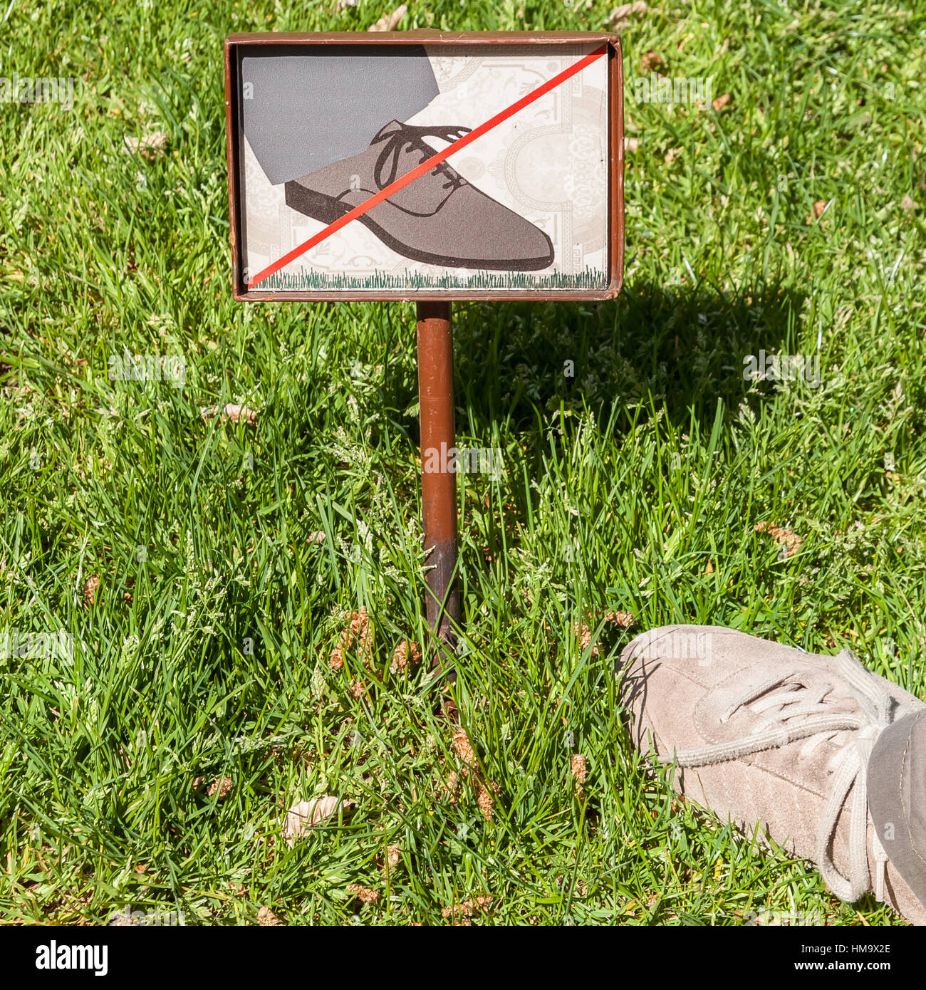 sign-meaning-keep-off-the-grass-with-a-foot-overstepping-the-warning