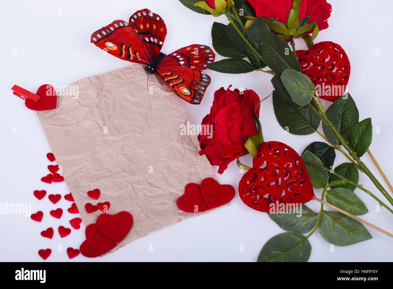 Red roses and red hearts on a white background Stock Photo - Alamy