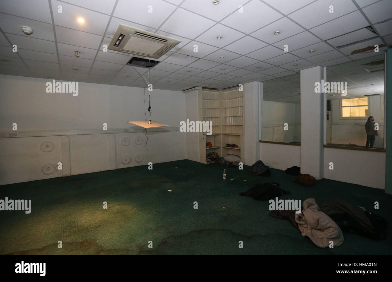 A squatter in a basement room at 4 Grosvenor Gardens, central London