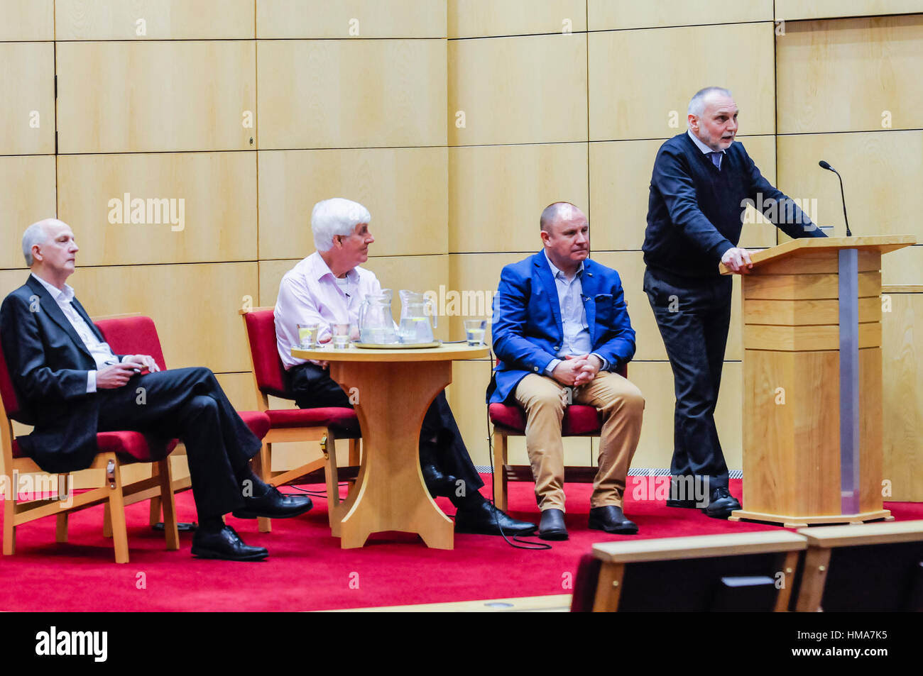 Belfast, Northern Ireland. 01 Feb 2017 - Sean Kelly takes to the podium during the 'Dealing With The Past' event organised by Rethinking Conflict takes place in Belfast.  Hosted by Reverend Gary Mason from East Belfast Mission, with guests Rev. Dr. Ken Newell, former Moderator of the Presbyterian Church in Ireland, political commentator and columnist Alex Kane, and former IRA Volunteer Sean Kelly, who was injured in the Shankill Bomb attack in 1993, and has worked towards the peace process since then.  The event was orginally planned to take place at the Skainos Centre in East Belfast, but was Stock Photo