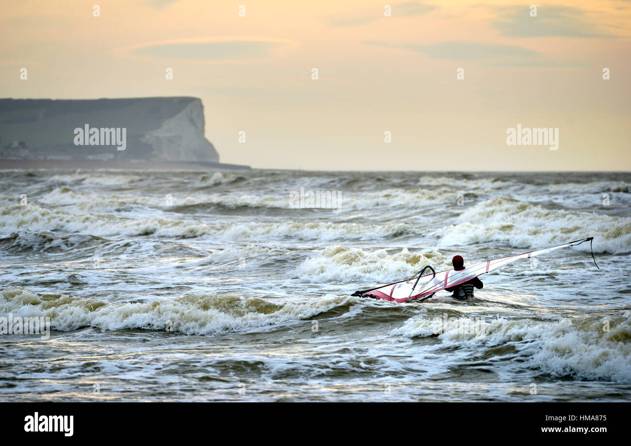 Seaford bay, East Sussex. 2nd February 2017. Kite surfers taking advantage of windy conditions on the south coast near Seaford, East Sussex. Credit: Peter Cripps/Alamy Live News Stock Photo