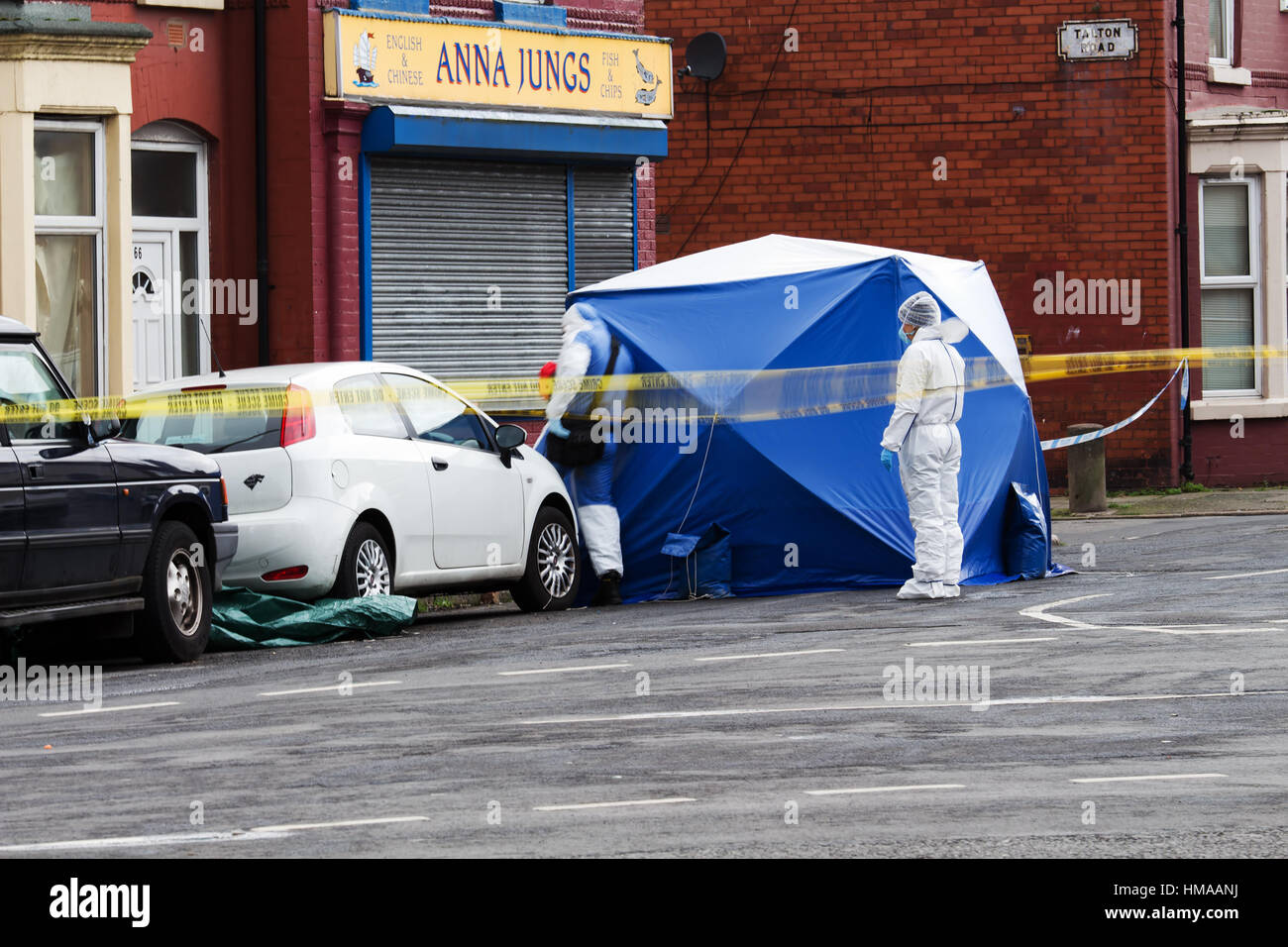 Liverpool, UK. 2nd Feb, 2017. Forensic officers comb the murder scene after a 26 yr old man was shot dead in the Wavertree area of Liverpool. Credit: ken biggs/Alamy Live News Stock Photo