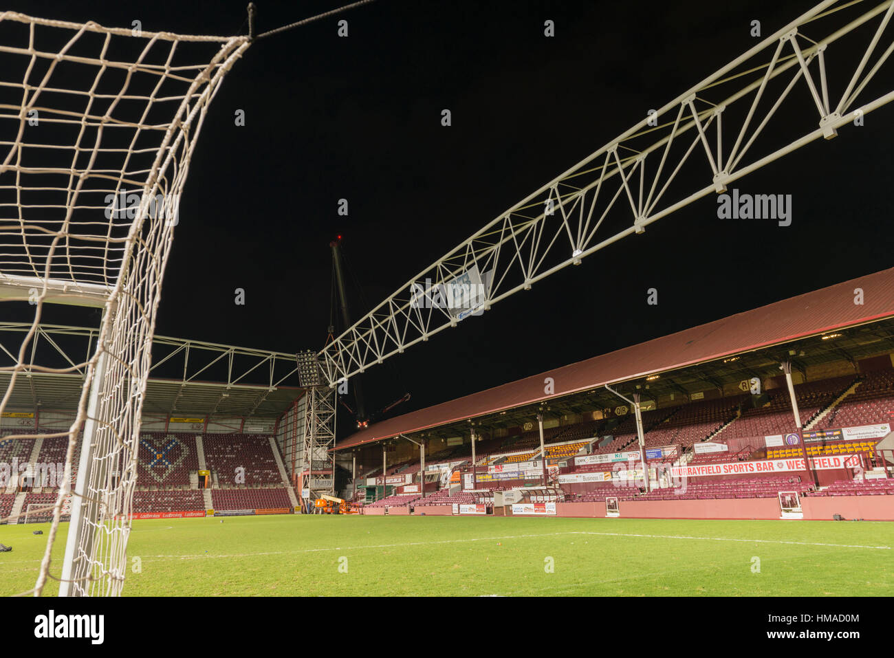 Edinburgh, UK. 2nd Feb 2017. Heart of Midlothian FC's redevelopment of Tynecastle Stadium completes the installation stage of a 104 ton steel structure over the existing main stand. This will allow the new stand to be built over the existing stand, which will remain in use until the end of season 2016/17. The new stand will be completed in September 2017 increasing ground capacity by over 3,500. Credit: Alan Paterson/Alamy Live News Stock Photo